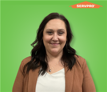 female employee with long hair wearing a brown sweater