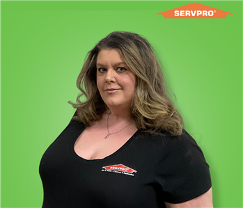 female employee with long hair wearing a black SERVPRO shirt
