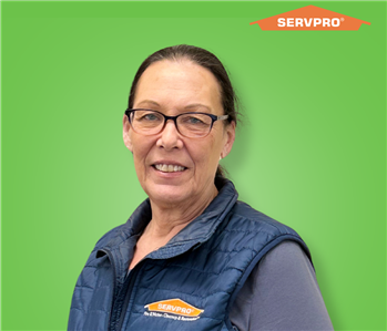 female employee wearing a blue SERVPRO vest